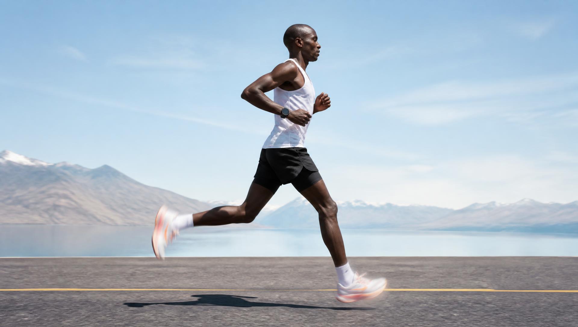 A marathon runner in mid-stride, shoes reduced to a motion blur under bright daylight